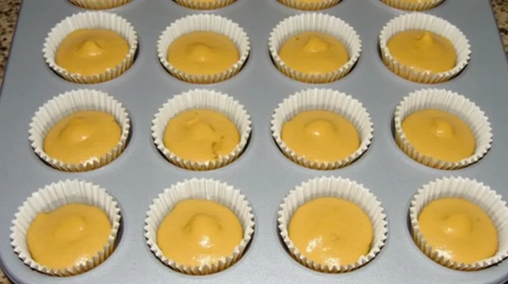 Divide the batter evenly among 12 muffin cups